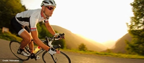 Image of a man cycling a Morzine road